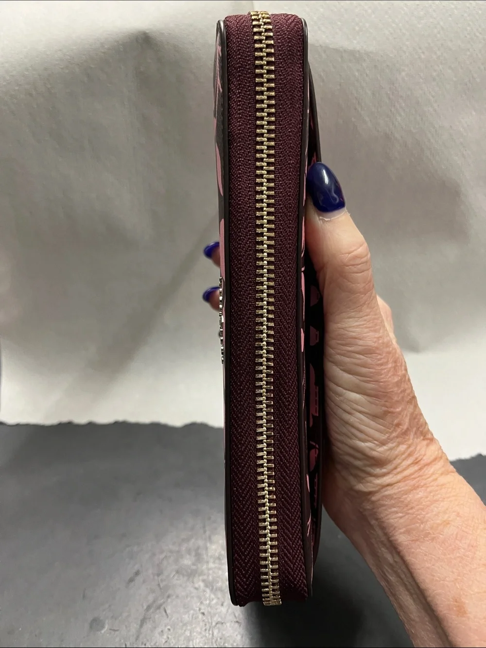 NWOT Kate Spade pink floral on dark maroon zip-around wallet